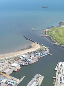 Oblique aerial view of the harbour and docks at Aberdeen, taken from the NW.