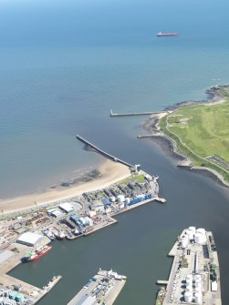 Oblique aerial view of the harbour and docks at Aberdeen, taken from the NW.