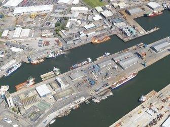 Oblique aerial view of the harbour and docks at Aberdeen, taken from the WSW.