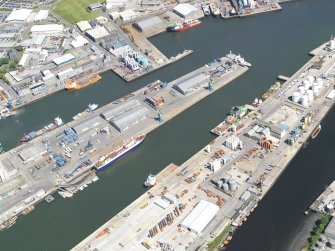 Oblique aerial view of the harbour and docks at Aberdeen, taken from the WSW.