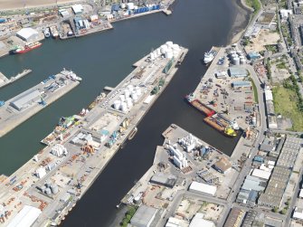 Oblique aerial view of the harbour and docks at Aberdeen, taken from the WSW.