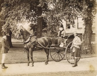 View of the Marquis and Marchioness of Huntly with horse and carriage at Aboyne Castle, 1878.

