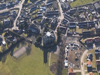 Oblique aerial view centred on the church, taken from the N.