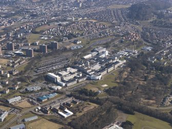 General oblique aerial view centred on the hospital, taken from the SW.