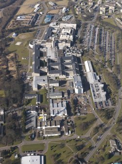 Oblique aerial view centred on the hospital, taken from the ESE.