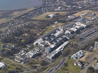 Oblique aerial view centred on the hospital, taken from the NE.