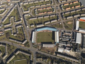 Oblique aerial view centred on the football stadium, taken from the SSW.