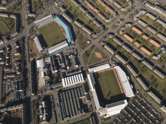 Oblique aerial view centred on the football stadia, taken from the ESE.