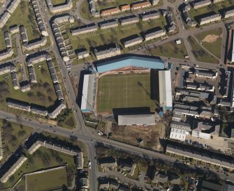 Oblique aerial view centred on the football stadium, taken from the SSW.