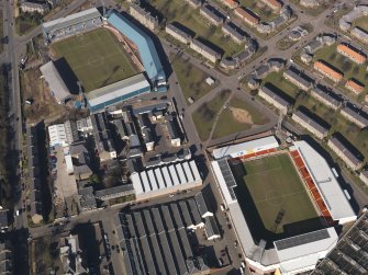 Oblique aerial view centred on the football stadia, taken from the SE.