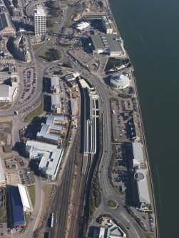 Oblique aerial view centred on the railway station, taken from the SW.
