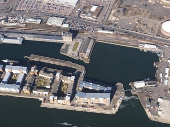 General oblique aerial view centred on the dock area, taken from the