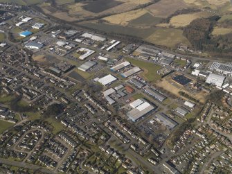 General oblique aerial view centred on the industrial estates, taken from the SE.