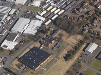 Oblique aerial view centred on the former officers' mess, taken from the SW.