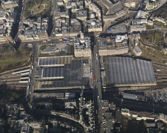 Oblique aerial view centred on the railway station, taken from the SSE.