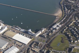 General oblique aerial view centred on harbour, taken from the SW.