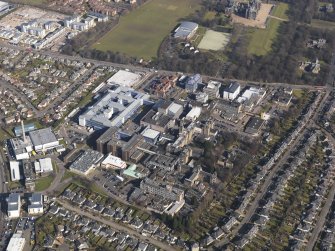 General oblique aerial view centred on the hospital, taken from the SW.