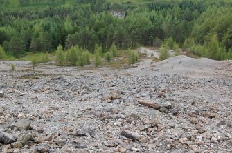 A photograph of Tyndrum Mine showing the remains of the incline winding platform located below.