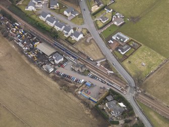 Oblique aerial view centred on the railway station, taken from the NW.