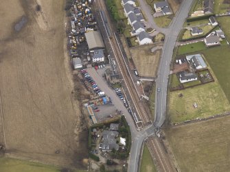 Oblique aerial view centred on the railway station, taken from the W.