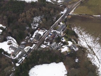 Oblique aerial view centred on the village, taken from the NE.