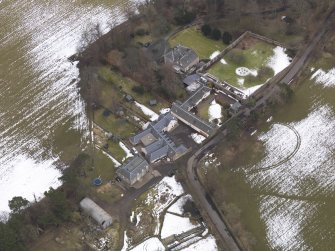 Oblique aerial view centred on the house, taken from the NW.