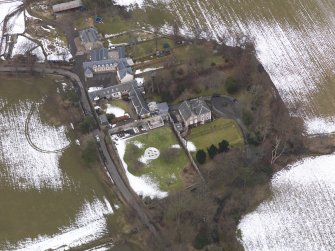 Oblique aerial view centred on the house, taken from the SSE.