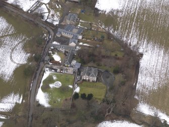 Oblique aerial view centred on the house, taken from the SE.