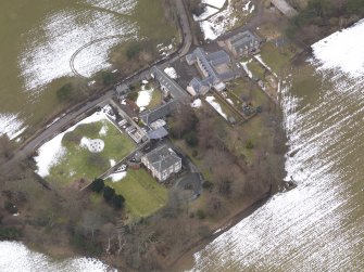 Oblique aerial view centred on the house, taken from the ESE.