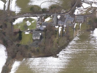 Oblique aerial view centred on the house, taken from the ENE.