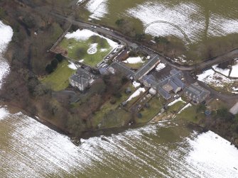 Oblique aerial view centred on the house, taken from the NE.