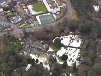 Oblique aerial view centred on the house, taken from the ENE.