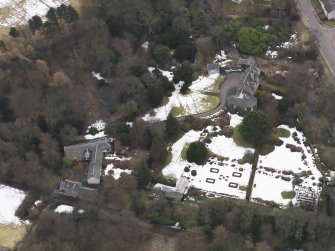 Oblique aerial view centred on the house, taken from the N.