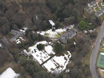Oblique aerial view centred on the house, taken from the NNW.