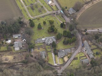 Oblique aerial view centred on the kirk, taken from the N.
