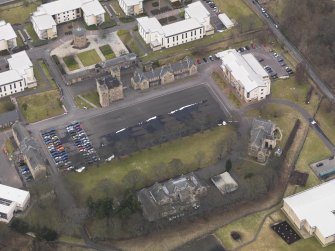 Oblique aerial view centred on the barracks, taken from the SE.