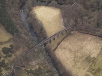 Oblique aerial view centred on the railway viaduct, taken from the NNE.