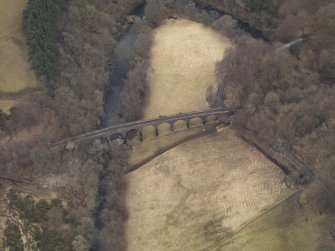 Oblique aerial view centred on the railway viaduct, taken from the N.