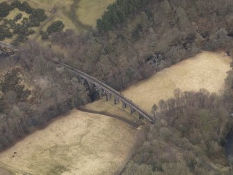 Oblique aerial view centred on the railway viaduct, taken from the NW.