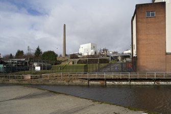 Dark grains plant and chimney, general view from canal side to SE