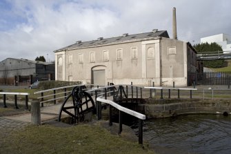 Former CO2 processing plant, view with canal bridge from SE. This building was originally part of the Eagle Foundry.