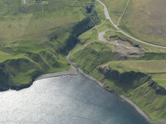 Oblique aerial view of the remains of the quarry, diatomite works and salmon fishing station at Inver Tote, taken from the ENE.