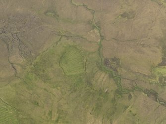 Oblique aerial view of the remains of the field and lazy beds, taken from the SSW.