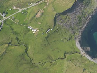 Oblique aerial view of Port Earlish and the remains of the field system and farmstead, taken from the SE.