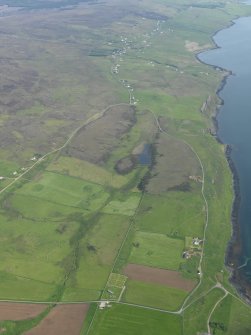 General oblique aerial view of Trumpan with Hallin beyond, taken from the NW.