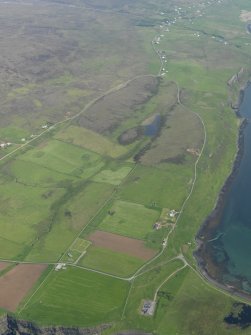 General oblique aerial view of Trumpan with Hallin beyond, taken from the WNW.