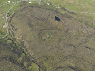 Oblique aerial view of the remains of Dun Colbost broch, taken from the SSW.