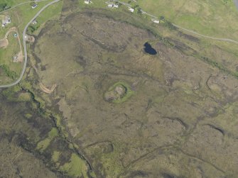 Oblique aerial view of the remains of Dun Colbost broch, taken from the S.