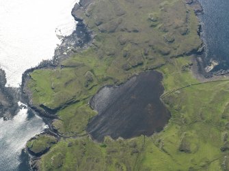 Oblique aerial view centred on Loch na h-Airde, the 'Viking Canal’ and the remains of the dun at Rubh' an Dunain, taken from the E.