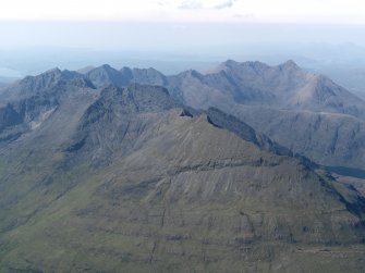 General oblique aerial view of the Cuillin Hills with Gars-bheinn in the foreground, taken from the SSE.